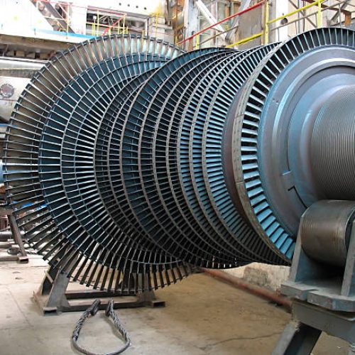 Power generator steam turbine during repair, machinery, pipes, tubes at a power plant